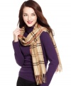 Cejan adds a posh feel to this classic, preppy plaid scarf that keeps the cold from infringing on your fab winter style.
