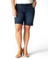 A dark wash lends a flattering finish to Levi's plus size Bermuda shorts, featuring a tilted rise for fuller back coverage.