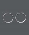 Like the little black dress of jewelry, you can never go wrong with a sophisticated pair of hoops. These large hoop earrings feature a smooth, round, sterling silver design. Approximate diameter: 1-1/5 inches.