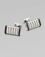 Signature, slim bar design in sterling silver edged with black sapphires.SilverSapphiresAbout 1 X ½Imported