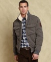This distressed and rugged bomber jacket from Tommy Hilfiger has your winter style covered.