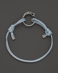 Eastern elements inform John Hardy's dragon head bracelet. It features a cotton cord band with an adjustable sliding closure. Eastern elements inform John Hardy's dragon head bracelet. It features a cotton cord band with an adjustable sliding closure.