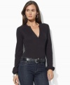 Sleek stretch jersey forms the foundation of a chic split-neck top from Lauren by Ralph Lauren.