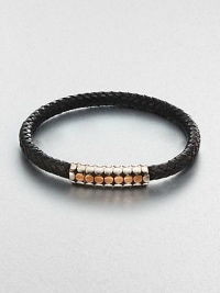 A simple design with modern sensibilities defines this woven leather bracelet, accented by a sterling silver and gold clasp.Sterling silver/GoldLeatherMagnetic claspAbout 3 diam.Imported