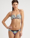 A bold, eclectic print and classic bikini silhouette combine to create an alluring design, including a removable halter strap for style versatility. Removable halter strapBandeau topBack clasp closureSexy, ruched sides on stretch bottomFully lined80% nylon/20% spandexHand washMade in USA