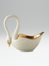 This graceful swan in white porcelain and 14kt gold accents is perfect for serving or decoration. Hand-gilded 7 edition: 3W X 7H X 6½D 13 edition: 6W X 13H X 13D Made in Portugal This graceful swan in white porcelain and 14kt gold accents is perfect for serving or decoration. Hand-gilded 7 edition: 3W X 7H X 6½D 13 edition: 6W X 13H X 13D Made in Portugal
