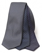 A classic silk tie, rendered in a subtle box pattern for dashing workday style.