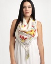 A glorious woven silk scarf with a perfectly charming print.42 X 42SilkHand washImported