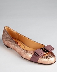 In micro-grid textured metallic leather, Salvatore Ferragamo's classic Varina flat feels fresh for the season.