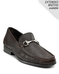 Crafted in soft pebbled leather, this handsome moc toe loafer is finished with the signature gancini logo bit at the tongue. Crafted in soft pebbled leather, this handsome moc toe loafer is finished with the signature gancini logo bit at the tongue.
