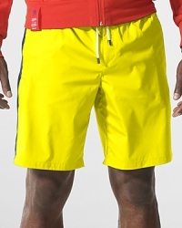 Designed to draw out your inner competitor, this lightweight swim trunk in quick-drying, chlorine-resistant polyester defines smart, athletic style. Designed to draw out your inner competitor, this lightweight swim trunk in quick-drying, chlorine-resistant polyester defines smart, athletic style.