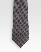 Patterned tie woven in fine Italian silk.About 3.1 wideSilkDry cleanMade in Italy