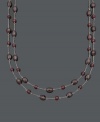 Add a subtle spark to your look with rich, red hues. This two-row necklace features 5 to 6 millimeter and 6 x 8 millimeter garnet beads (85 ct. t.w.) strung on delicate sterling silver chains. Approximate lengths: 16 and 17 inches.