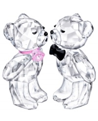 Love is in the air for this Kris Bear couple. Both figurines are positively glowing, puckering up in faceted Swarovski crystal with a pretty pink necklace and black bow tie. A romantic gift or cute cake topper! Love is in the air for this Kris Bear couple. Both figurines are positively glowing, puckering up in faceted Swarovski crystal with a pretty pink necklace and black bow tie. A romantic gift or cute cake topper!