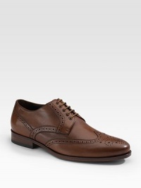 A heritage style for any gentleman of style, crafted in leather with brogue-style perforations. Embossed logo Padded insole Leather/rubber sole Imported A heritage style for any gentleman of style, crafted in leather with brogue-style perforations. Embossed logo Padded insole Leather/rubber sole Imported