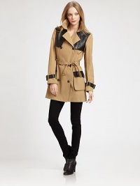 The classic double-breasted trench, updated with sleek leather trim for a modern-day spin.Notch collarDouble-breasted button frontBelted cuffsSelf-beltFlap and patch pocketsBack zip-ventAbout 32 from shoulder to hemCottonDry cleanImportedModel shown is 5'9 (175cm) wearing US size Small. The classic double-breasted trench, updated with sleek leather trim for a modern-day spin.Notch collarDouble-breasted button frontBelted cuffsSelf-beltFlap and patch pocketsBack zip-ventAbout 32 from shoulder to hemCottonDry cleanImportedModel shown is 5'9 (175cm) wearing US size Small.