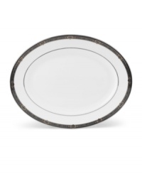 For nearly 150 years, Lenox has been renowned throughout the world as a premier designer and manufacturer of fine china. The Vintage Jewel pattern from Lenox's dinnerware and dishes collection evokes a more gracious era, combining pure white bone china with a dark, richly patterned band of muted gold, taupe, charcoal, and black, and accented with subtle touches of cobalt blue. For nearly 150 years, Lenox has been renowned throughout the world as a premier designer and manufacturer of fine china. The Vintage Jewel pattern from Lenox's dinnerware and dishes collection evokes a more gracious era, combining pure white bone china with a dark, richly patterned band of muted gold, taupe, charcoal, and black, and accented with subtle touches of cobalt blue.