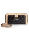 Portable perfection defines this laid-back luxe design from GUESS that's a wallet and wristlet in one. Posh signature embossing and glam, gold-tone hardware make a statement, while the impeccably organized interior offers plenty of credit card pockets and two full billfolds.