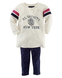 An ultra-comfortable set includes a stylish collegiate-inspired varsity fleece sweatshirt and legging, rendered in a stripe and owl print. An ultra-comfortable set includes a stylish collegiate-inspired varsity fleece sweatshirt and legging, rendered in a stripe and owl print.