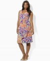 Smooth paisley jersey flatters the body in a feminine A-line silhouette in this plus size look from Lauren by Ralph Lauren with an elegant cross-wrap neckline.