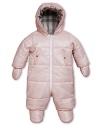 A plaid-lined snowsuit in soft pink for sweet winter chic.