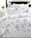 A delicate border of violets frames this crisp white cotton Martha Stewart Collection decorative pillow with charm and elegance.