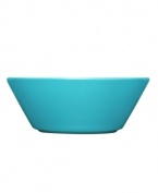 With a minimalist design and unparalleled durability, the Teema bowl makes preparing and serving soup or cereal a cinch. Featuring a sleek, angled edge in glossy turquoise-colored porcelain by Kaj Franck for Iittala.