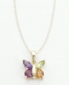 A bouquet of amethyst, citrine, peridot and garnet  form an elegant butterfly pendant set in 14k gold. Chain measures 18 inches.