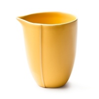 Borrowing from nature, this porcelain creamer has a highly glossed surface and unusual contours, creating an interesting silhouette - a DVF signature - on the table. Borrowing from nature, this porcelain creamer has a highly glossed surface and unusual contours, creating an interesting silhouette - a DVF signature - on the table.