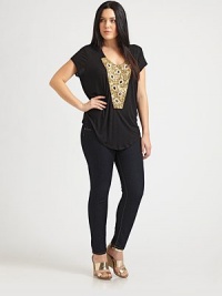 Shine on in this tee featuring awe-inspiring, gilded embellishments. Its curved hem offers an added touch of feminine appeal. Embellished u-necklineShort sleevesCurved hemAbout 27 from shoulder to hem60% polyester/37% rayon/3% spandexDry cleanMade in USA Shine on in this tee featuring awe-inspiring, gilded embellishments. Its curved hem offers an added touch of feminine appeal. Embellished u-necklineShort sleevesCurved hemAbout 27 from shoulder to hem60% polyester/37% rayon/3% spandexDry cleanMade in USA