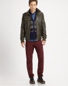 A butter-soft Italian leather jacket with military-inspired epaulettes, ribbed-knit trim and a plethora of zipper pockets.Stand collarFront zipperEpaulettesZippered pocketsRibbed-knit detailsBack yokeAbout 27 from shoulder to hemLeatherDry clean by leather specialistImported of Italian fabric