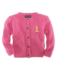 A preppy, patched cardigan is knit in a luxuriously soft wool and angora blend. A preppy, patched cardigan is knit in a luxuriously soft wool and angora blend.