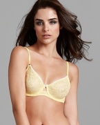 A sheer two tone floral print underwire bra with contrast scalloped edge trim and small bow detail.
