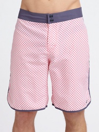 A dashing diamond print pattern in a vibrant summer hue lends modern style to a casual swim favorite.Snap button frontBack flap pocketInseam, about 9NylonMachine washImported A dashing diamond print pattern in a vibrant summer hue lends modern style to a casual swim favorite.Snap button frontBack flap pocketInseam, about 9NylonMachine washImported