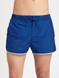A modern, tailored approach to classic beachwear, woven in colorblocked, quick-drying nylon with contrast piping and signature logo accent.Elastic drawstring waistSide slash, back welt pocketsInseam, about 3PolyesterMachine washImported A modern, tailored approach to classic beachwear, woven in colorblocked, quick-drying nylon with contrast piping and signature logo accent.Elastic drawstring waistSide slash, back welt pocketsInseam, about 3PolyesterMachine washImported