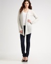 Ultra-soft cashmere shapes the body with and angular hem and bell sleeves. Dry clean or hand wash Imported