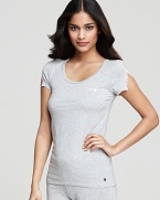 Lounge around in style and comfort. Juicy Couture's short sleeve tee in soft fabric with lace and button detail.