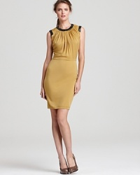 This slim, jewel-toned silhouette is embellished with glossy beads at the neckline and shoulders, for a sophisticated dinner-party look. This slim, jewel-toned silhouette is embellished with glossy beads at the neckline and shoulders, for a sophisticated dinner-party look.