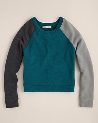 The raglan sleeves and the complimentary colorblock pattern adds warmth to this 80s-inspired pullover from ALTERNATIVE. The raglan sleeves and the complimentary colorblock pattern adds warmth to this 80s-inspired pullover from ALTERNATIVE.