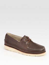 Crafted with boat-shoe inspired styling, this casual comfort essential is highlighted by contrast rubber sole and stitching.Leather upperLeather liningPadded insoleRubber soleImported Crafted with boat-shoe inspired styling, this casual comfort essential is highlighted by contrast rubber sole and stitching.Leather upperLeather liningPadded insoleRubber soleImported