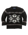 An intarsia-knit snowflake design adorns this timeless crewneck sweater for heritage style.