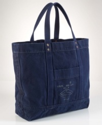 A rugged carryall is crafted from durable cotton canvas and finished with a surplus-inspired graphic print for a masculine look and feel. A rugged carryall is crafted from durable cotton canvas and finished with a surplus-inspired graphic print for a masculine look and feel.