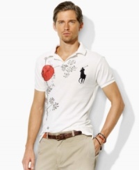 Crafted in a trim, modern fit from breathable cotton mesh, a short-sleeved polo shirt gets a bold update with an expedition-inspired graphic print. Crafted in a trim, modern fit from breathable cotton mesh, a short-sleeved polo shirt gets a bold update with an expedition-inspired graphic print.