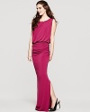An open back boasts a stunning finish to this Laundry by Shelli Segal gown, trimmed in gilded, golden beads.
