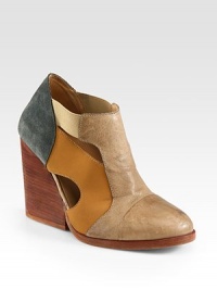 A chunky, stacked heel lifts this design of paneled leather and suede, topped with peek-a-boo cutouts. Stacked heel, 4 (100mm)Leather and suede upper with elasticized strapsPull-on styleLeather lining and solePadded insoleImportedOUR FIT MODEL RECOMMENDS ordering true size. A chunky, stacked heel lifts this design of paneled leather and suede, topped with peek-a-boo cutouts. Stacked heel, 4 (100mm)Leather and suede upper with elasticized strapsPull-on styleLeather lining and solePadded insoleImportedOUR FIT MODEL RECOMMENDS ordering true size.