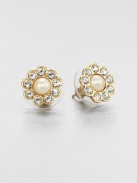 Sparkling rhinestone frame a lustrous faux pearl to form a feminine, floral-inspired design.Plastic pearlsGlass stonesGoldtoneSize, about .5Post backImported Sparkling rhinestone frame a lustrous faux pearl to form a feminine, floral-inspired design.Plastic pearlsGlass stonesGoldtoneSize, about .5Post backImported