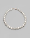 Elegant organic white man-made pearls make a perfect finishing touch. 14mm white round pearls Length, about 20 Mabé pearl and 18k gold vermeil push-lock clasp Made in Spain