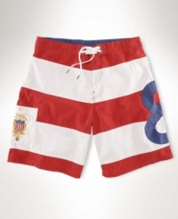 A sporty swim trunk with bold stripes and athletic-inspired embroidery is crafted in a quick-drying cotton-nylon blend for an attractive option on the beach. A sporty swim trunk with bold stripes and athletic-inspired embroidery is crafted in a quick-drying cotton-nylon blend for an attractive option on the beach.