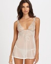 Sheer fabric is elegantly decorated with feminine floral embroidery, for a look that is simple yet ultra sexy. Deep, plunging necklinePull-on styleMatching sheer bottoms with tie sidesCotton gussetAbout 26½ from shoulder to hem90% nylon/10% elastaneHand washMade in Italy