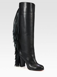 Rocker-chic fringe adds movement to this towering boot of sumptuous Italian leather. Stacked heel, 3½ (90mm)Shaft, 15½Leg circumference, 14Leather upperPull-on styleLeather liningSignature red leather solePadded insoleMade in Italy Rocker-chic fringe adds movement to this towering boot of sumptuous Italian leather. Stacked heel, 3½ (90mm)Shaft, 15½Leg circumference, 14Leather upperPull-on styleLeather liningSignature red leather solePadded insoleMade in Italy